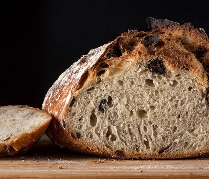 A sourdough loaf cut open to show the crumb