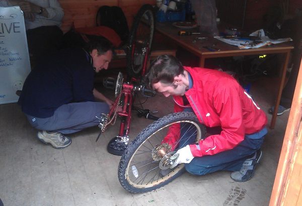 A mechanic working on a bicycle